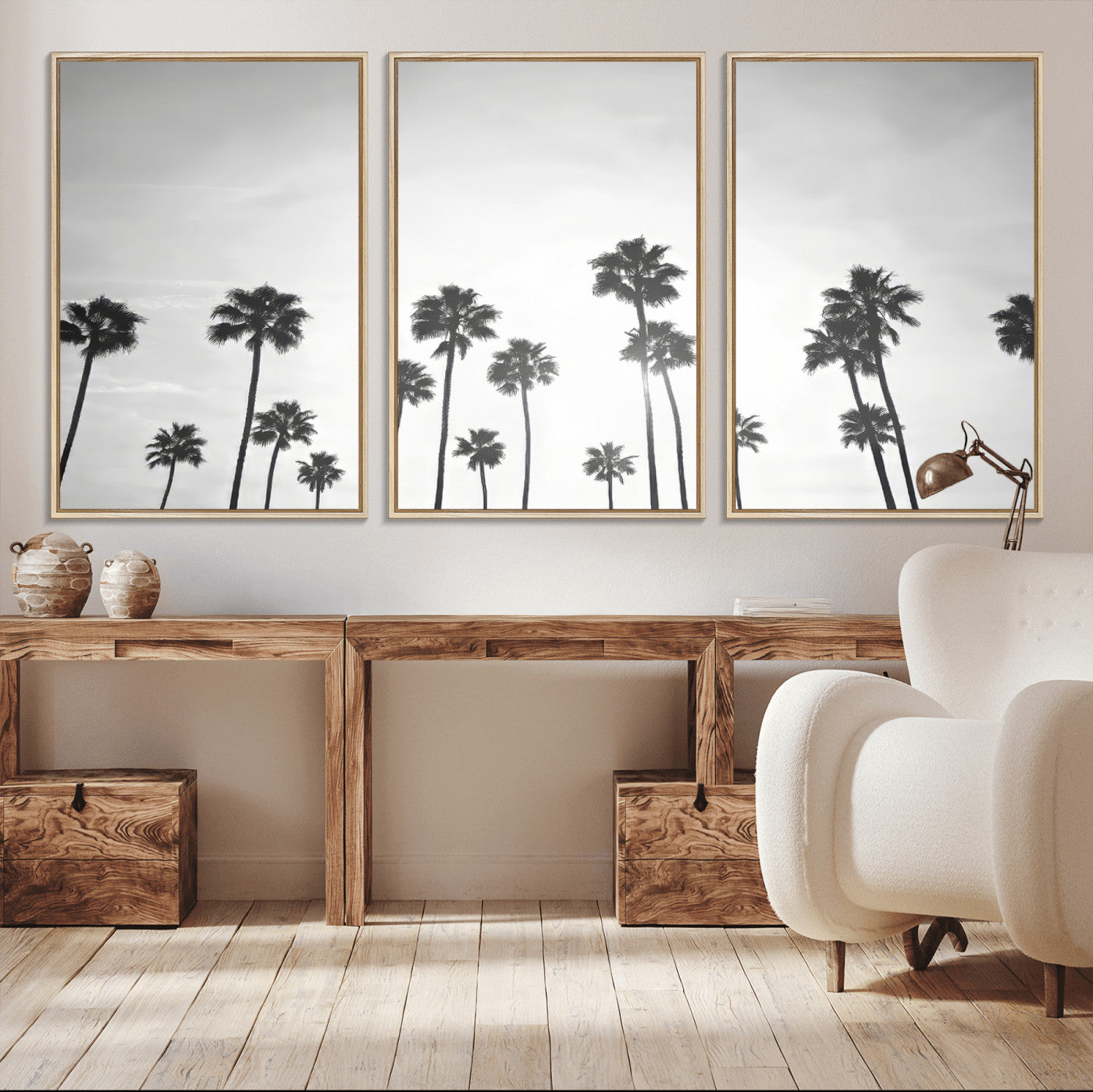 A black and white minimalist scene featuring tall palm trees silhouetted against a bright sky, creating a dreamy and timeless tropical aesthetic.