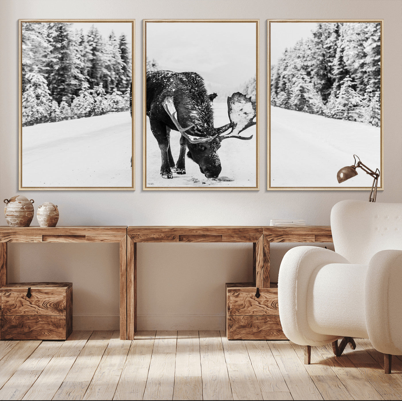 A majestic moose grazing in the snow-covered wilderness, surrounded by snow-covered trees, creating a peaceful winter scene.