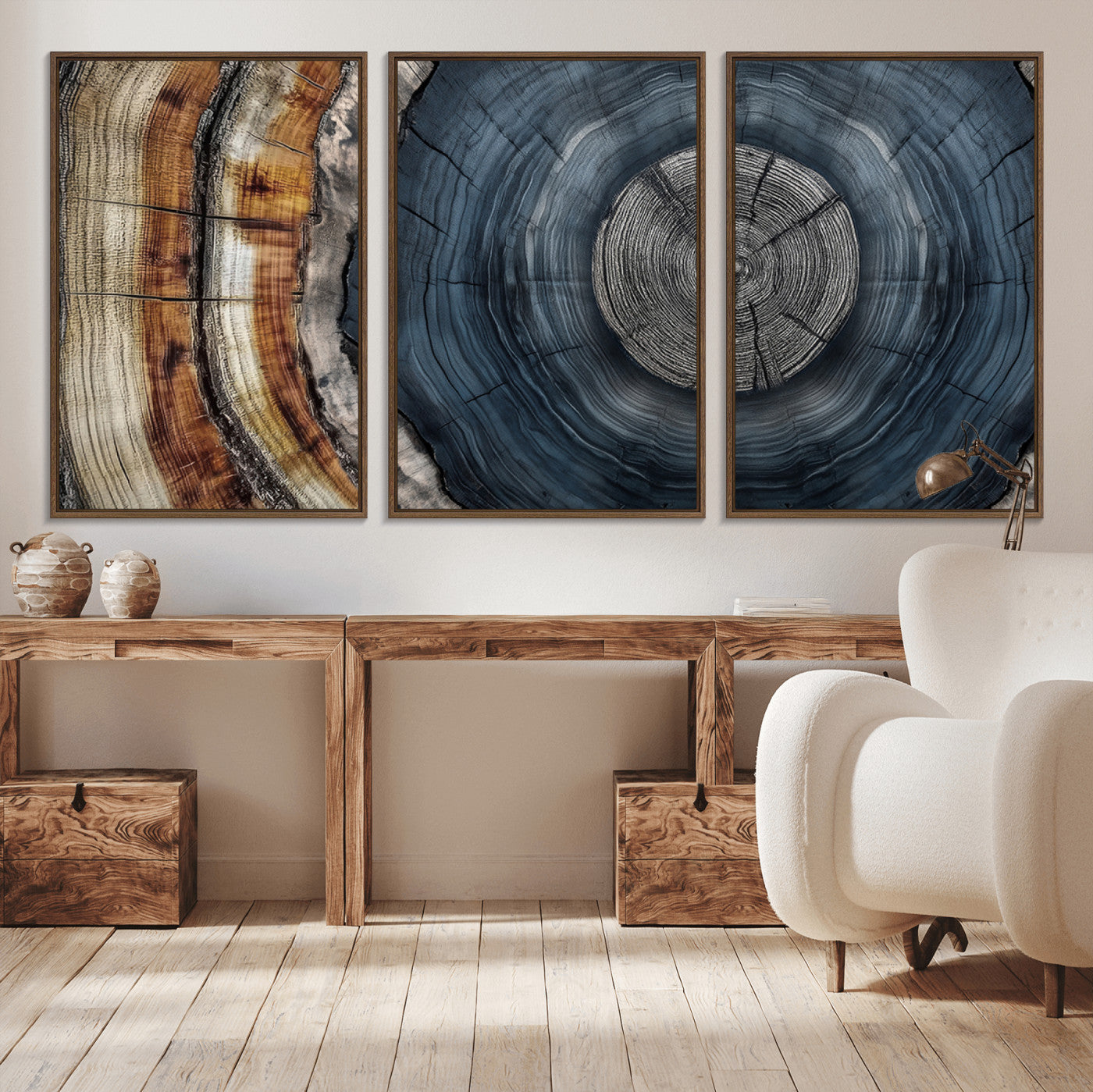A stunning close-up of a tree trunk showing the intricate, circular growth rings, showcasing the natural textures and rich contrasts in deep blues, browns, and silvers.