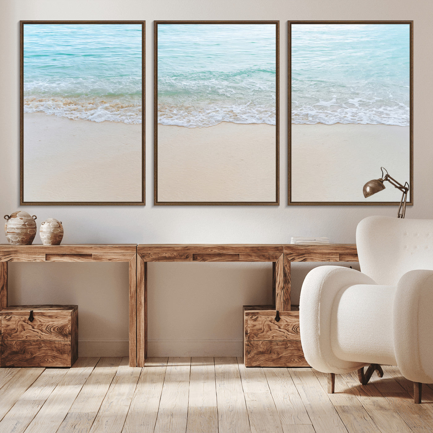 Soft shoreline with gentle aqua waves on smooth sand, ideal for minimalist coastal or pastel ocean-inspired home wall decor.