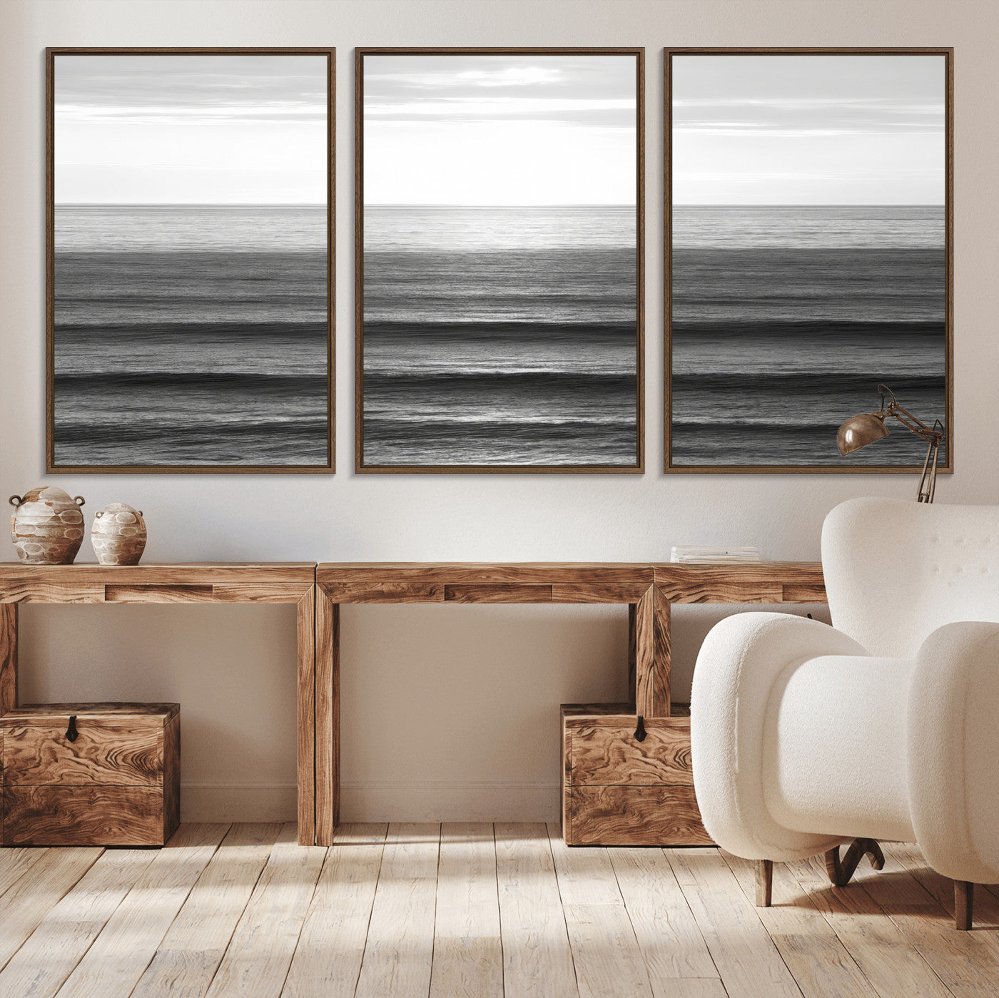 Minimalist black and white ocean view with layered waves reflecting sunlight, evoking a sense of calm and coastal serenity.