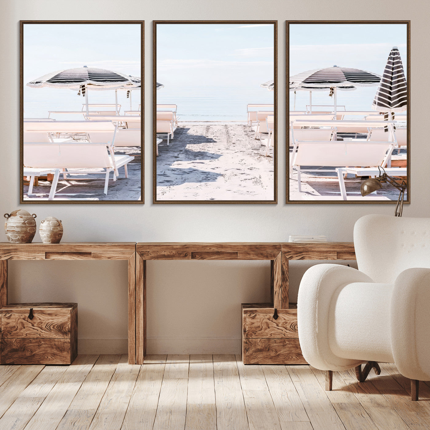 A serene minimalist beach scene featuring striped umbrellas, soft pastel sand, and an elegant lounge setup, creating a tranquil and stylish coastal retreat.