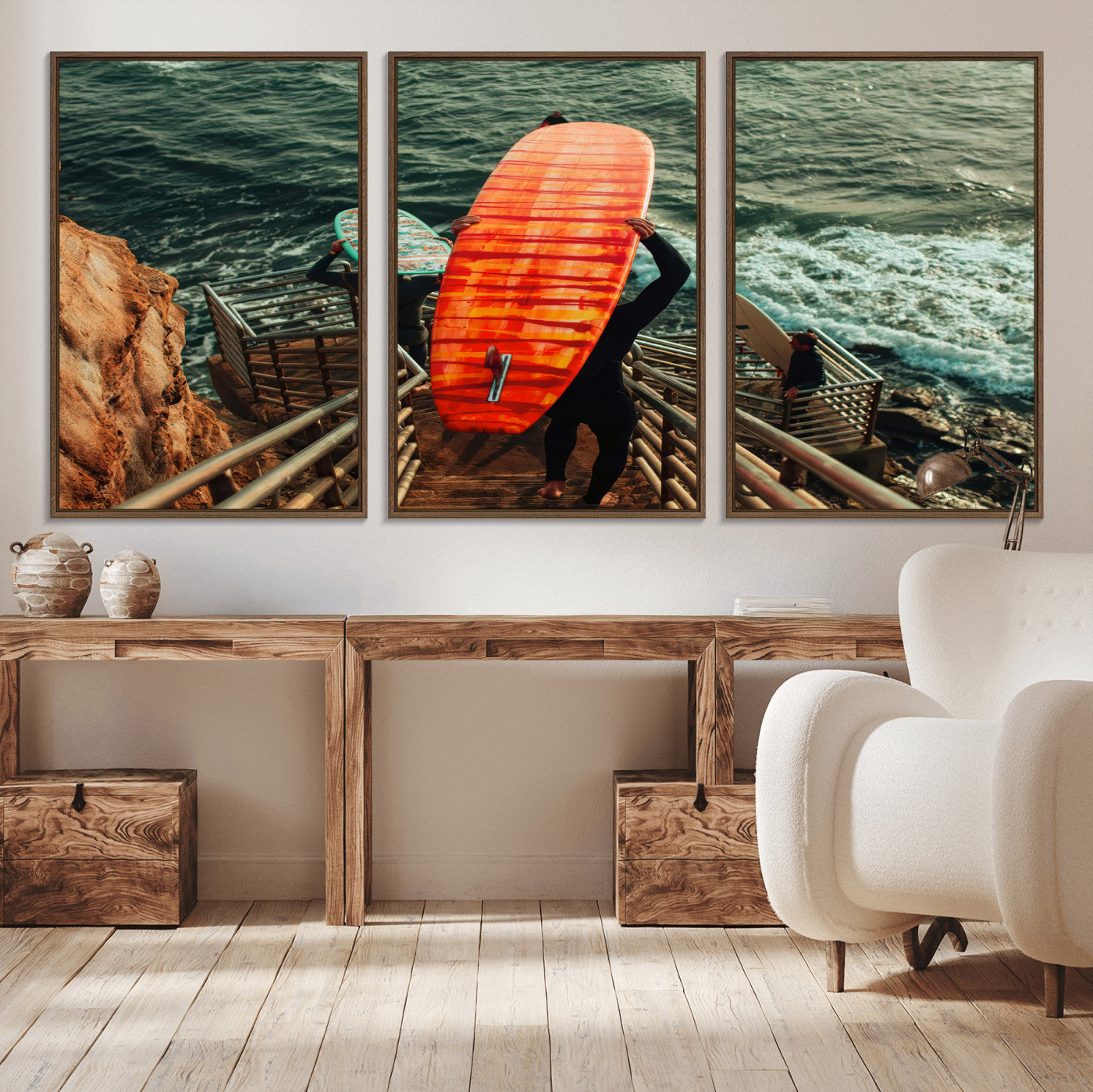 A surfer carrying a bold orange surfboard down a rugged staircase toward the ocean, bathed in golden hour light, capturing the energy of coastal adventure.