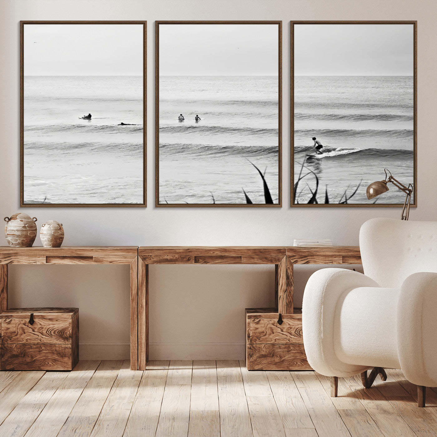 Monochrome canvas of surfers on calm ocean waves, ideal for minimalist coastal or beach-inspired interior decor.