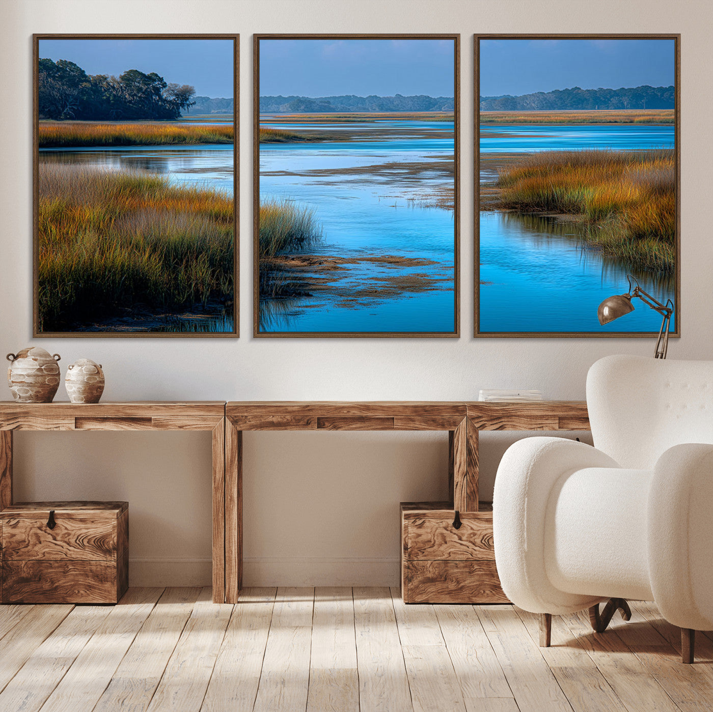 A peaceful marshland scene with calm blue water reflecting the surrounding grasses and trees, capturing the beauty of nature in a serene landscape.