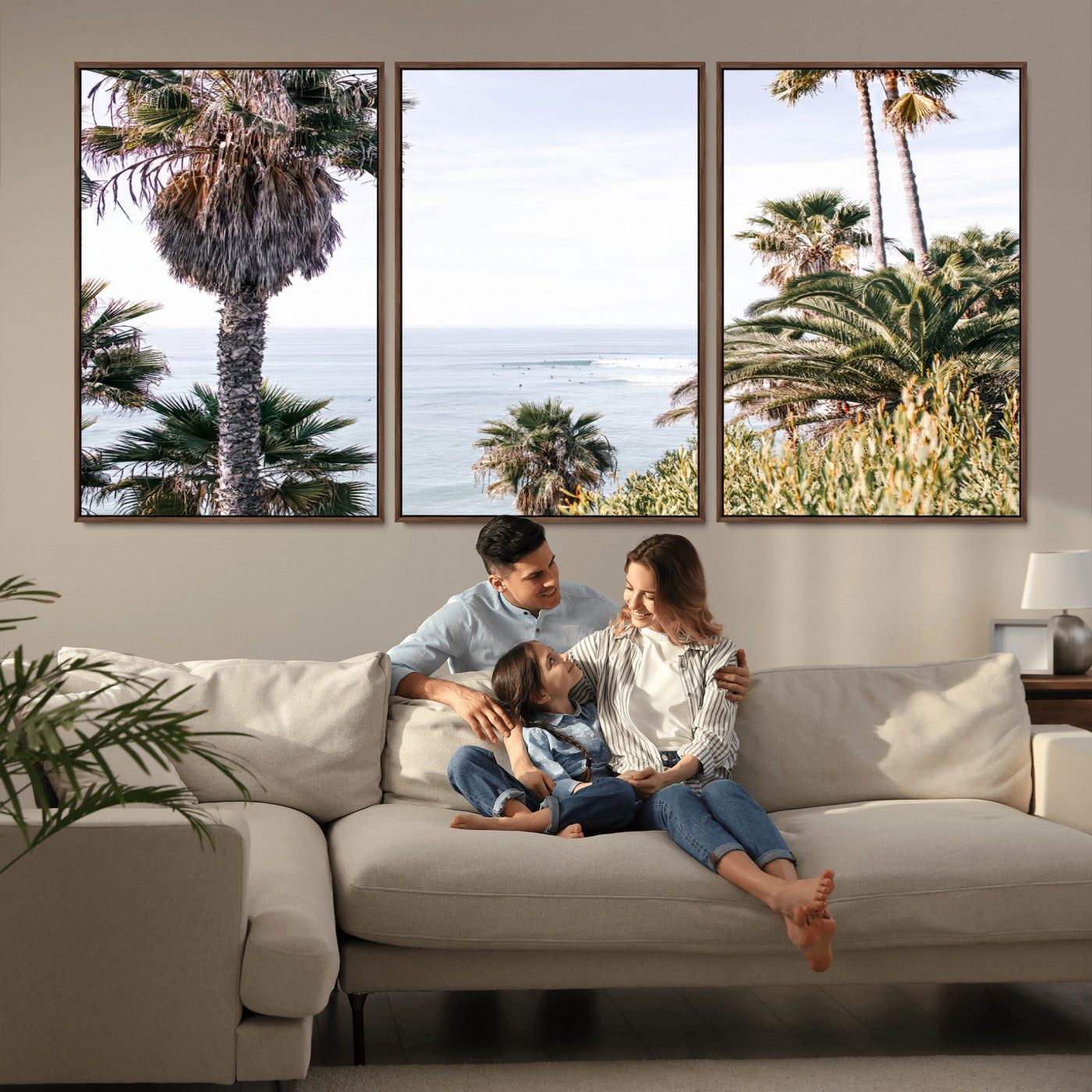 Scenic coastal view with tall palm trees overlooking a calm ocean, soft blue waves, and surfers in the distance, creating a peaceful tropical vibe.