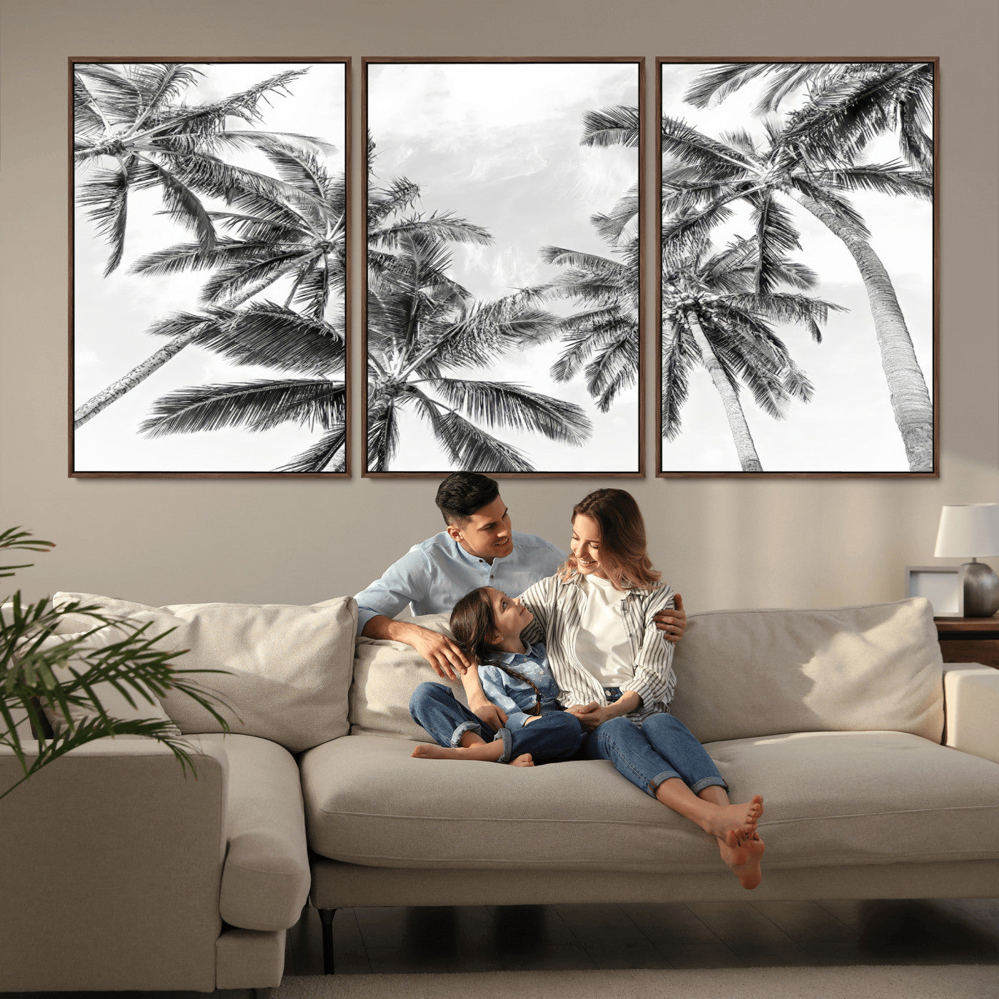 Black and white tropical palm trees viewed from below, swaying gently against a bright sky, creating a serene and elegant coastal atmosphere.