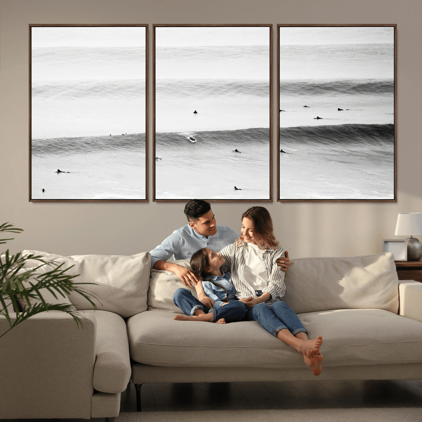 A monochrome photograph of swimmers gliding through gentle ocean waves, evoking a sense of calm and movement.