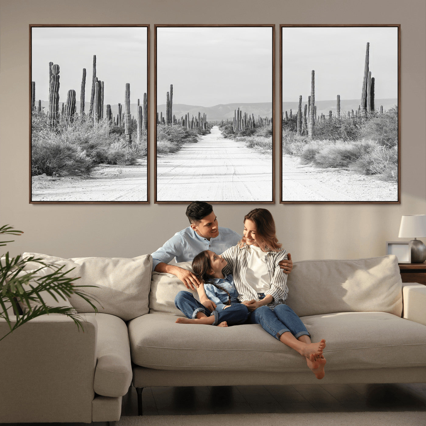 A black and white desert road stretching through a cactus-filled landscape, creating a rugged and timeless southwestern aesthetic with a sense of adventure.