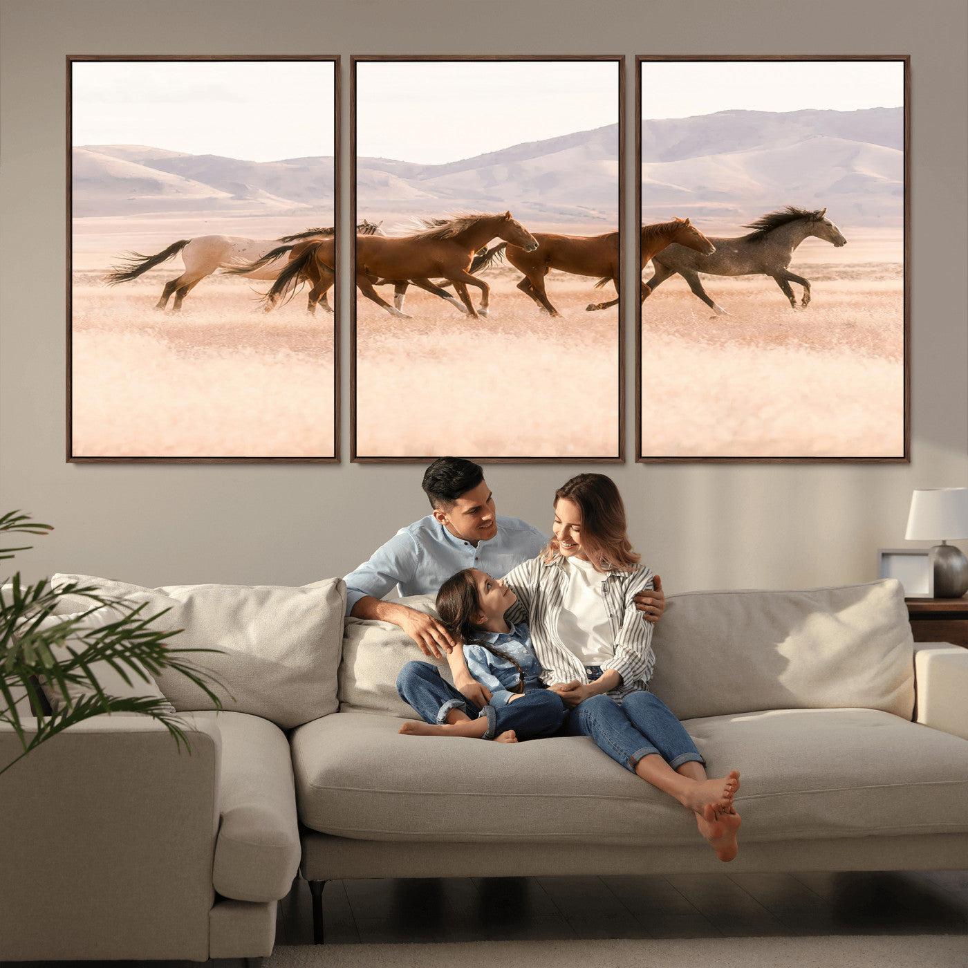 A herd of wild horses galloping through a sunlit desert plain with mountains in the background, perfect for rustic or western-themed wall decor.