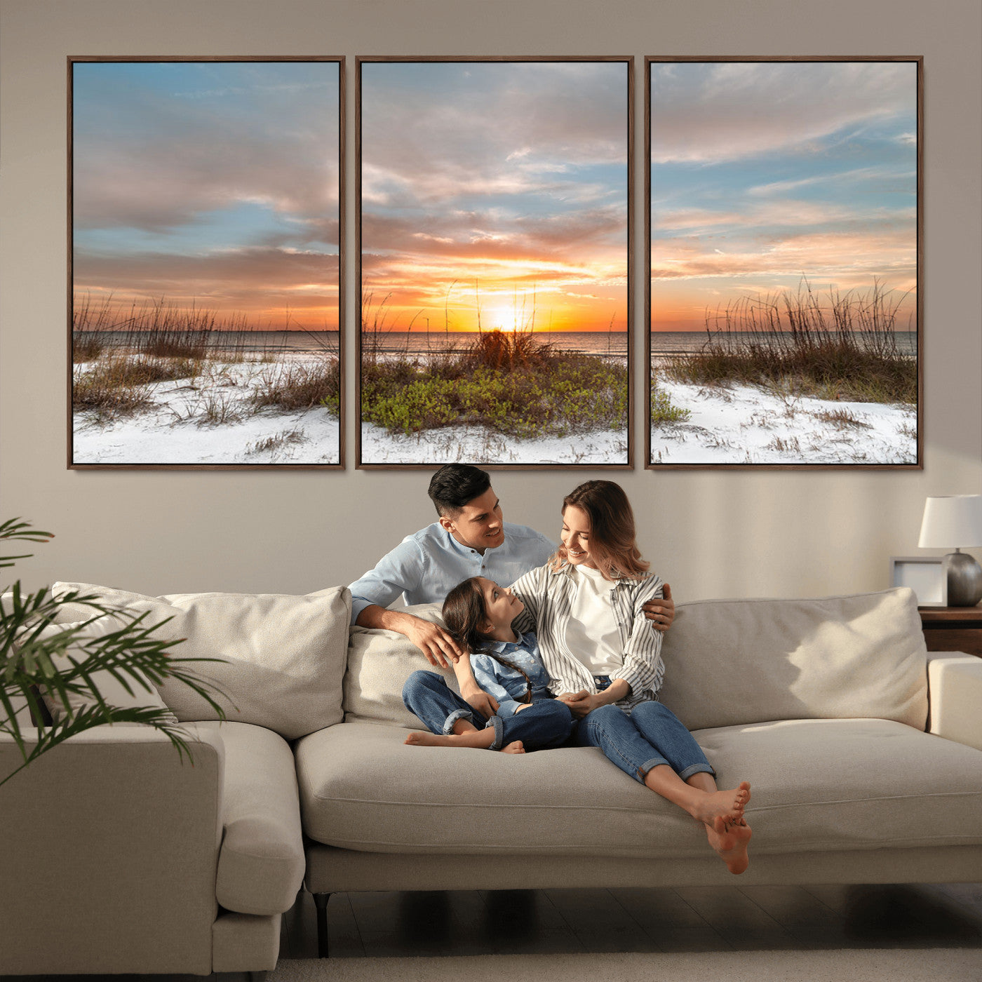 A tranquil beach scene featuring golden sunset hues over the water, with grasses in the foreground and a peaceful, serene atmosphere.