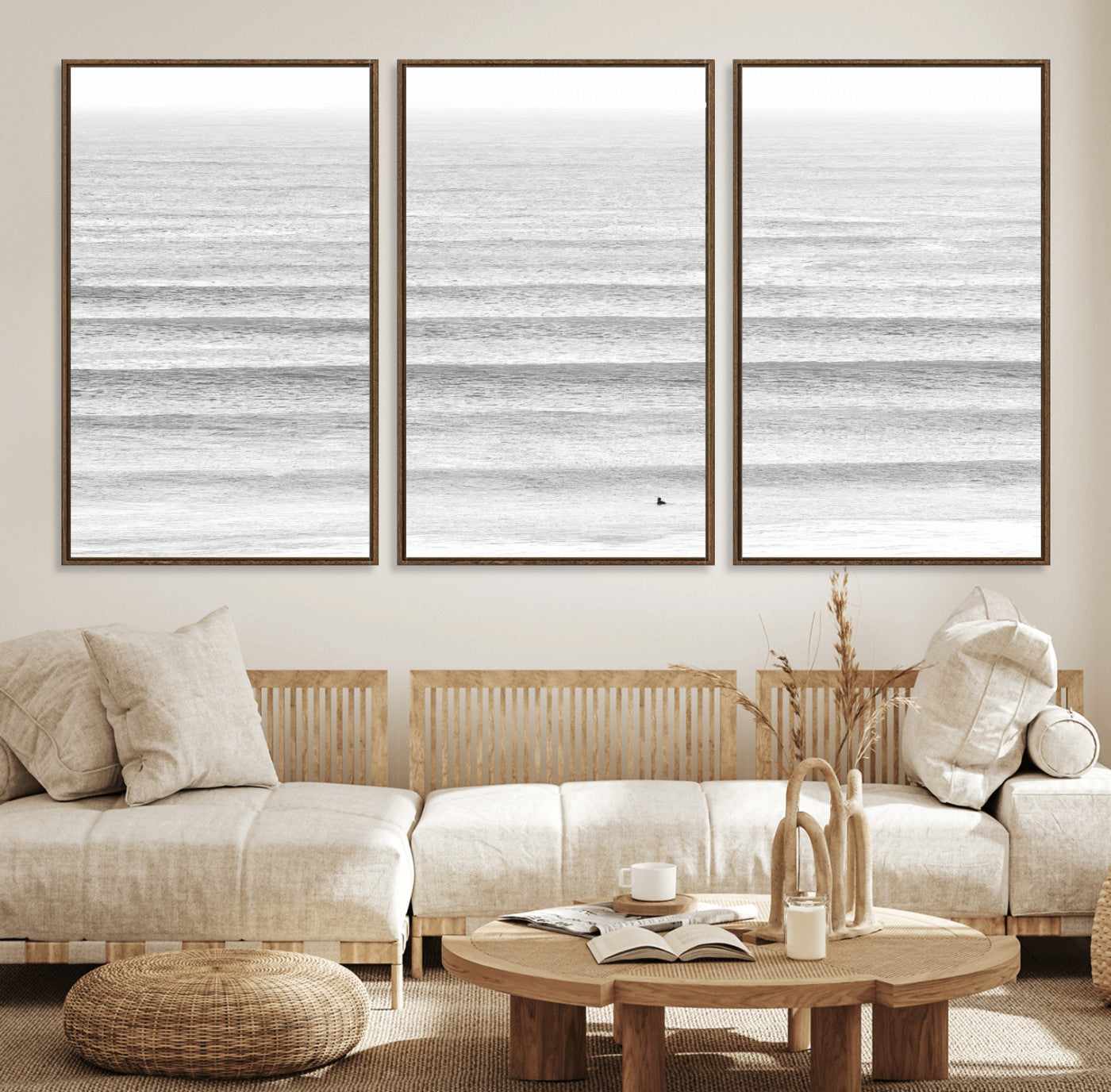 Monochrome photo of a lone surfer in calm layered waves, perfect for minimalist coastal or moody ocean-inspired wall decoration.