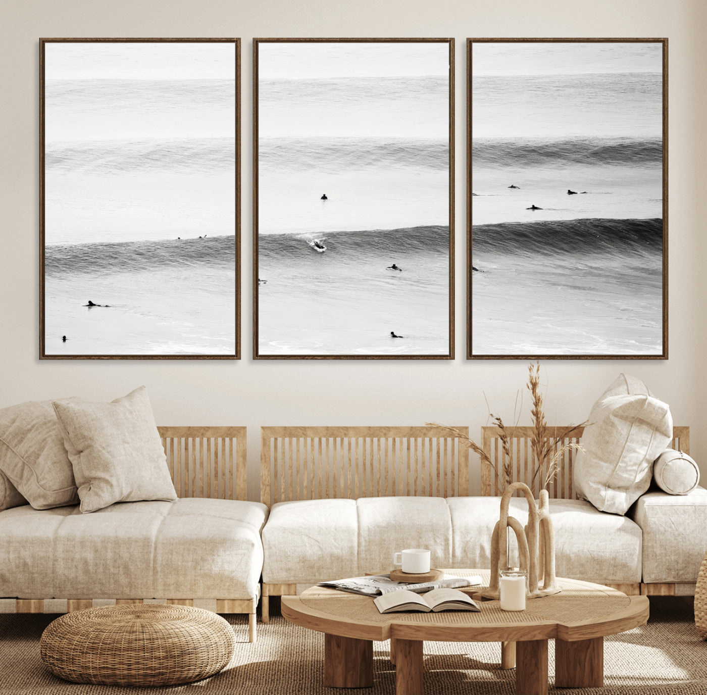 A monochrome photograph of swimmers gliding through gentle ocean waves, evoking a sense of calm and movement.