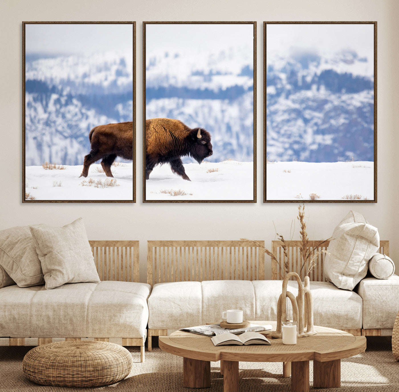 A lone bison walks across snowy ground with blue-toned mountain range behind, ideal for rustic or western farmhouse interiors.