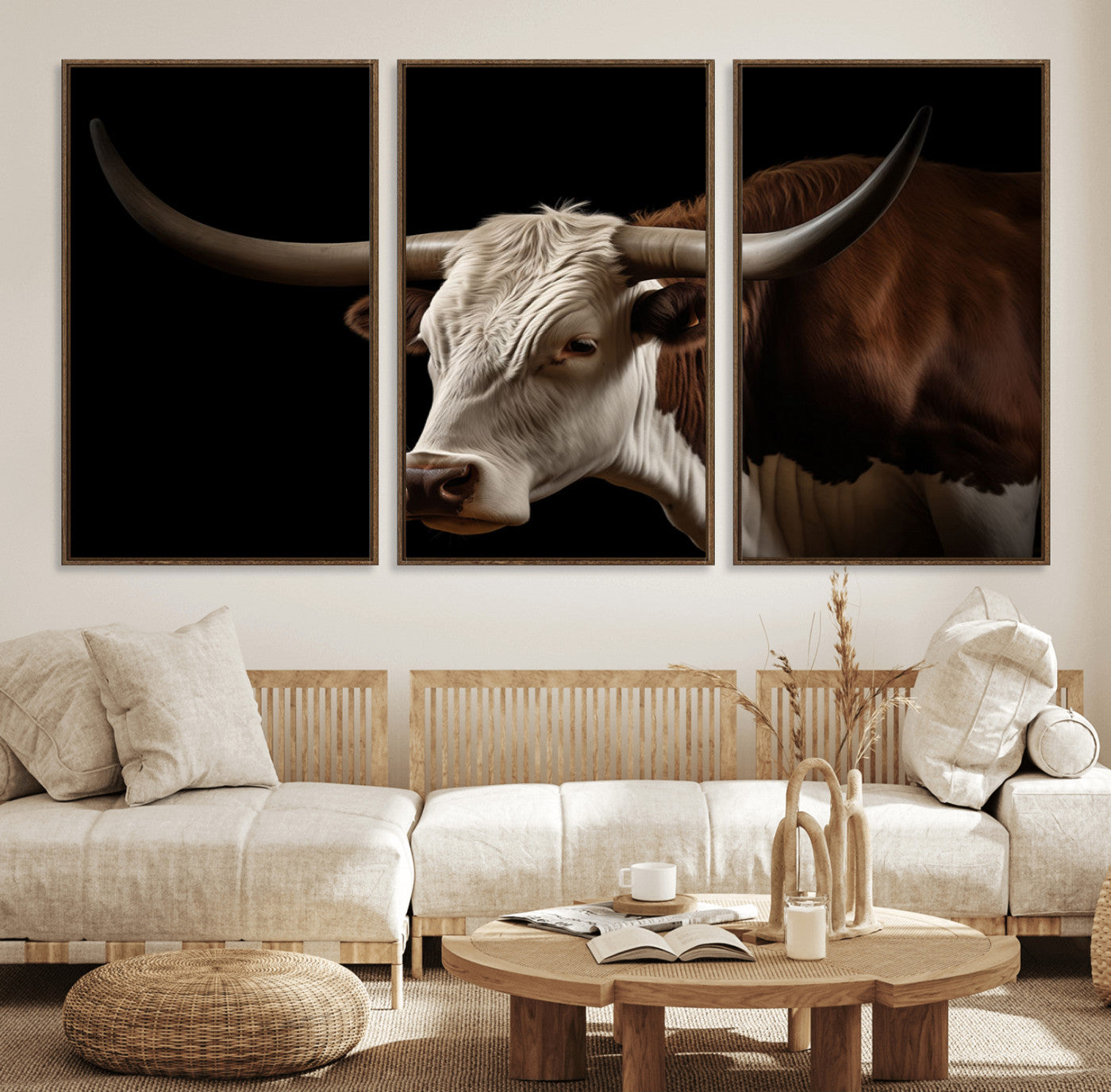 "Close-up of a brown and white longhorn cow with prominent curved horns against a black background."