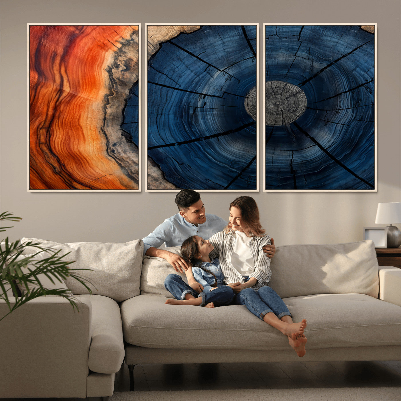 A captivating close-up of a tree trunk, showcasing its concentric rings in rich shades of blue, orange, and brown, highlighting the organic patterns of natural wood.