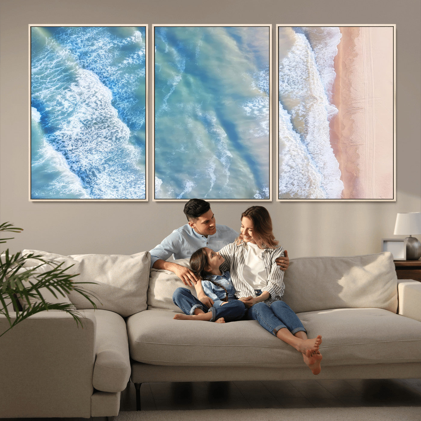 Aerial photo of soft blue waves meeting sandy shore, perfect for modern coastal or beach-themed decor with a light and tranquil aesthetic.