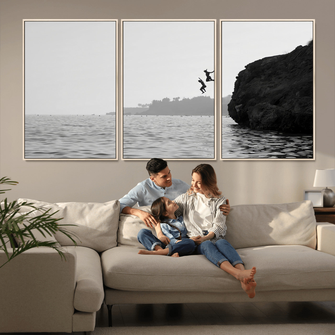 Black and white canvas of two figures cliff jumping into the sea, captured with moody tones, ideal for modern coastal or adventure-themed home decor. 2/2