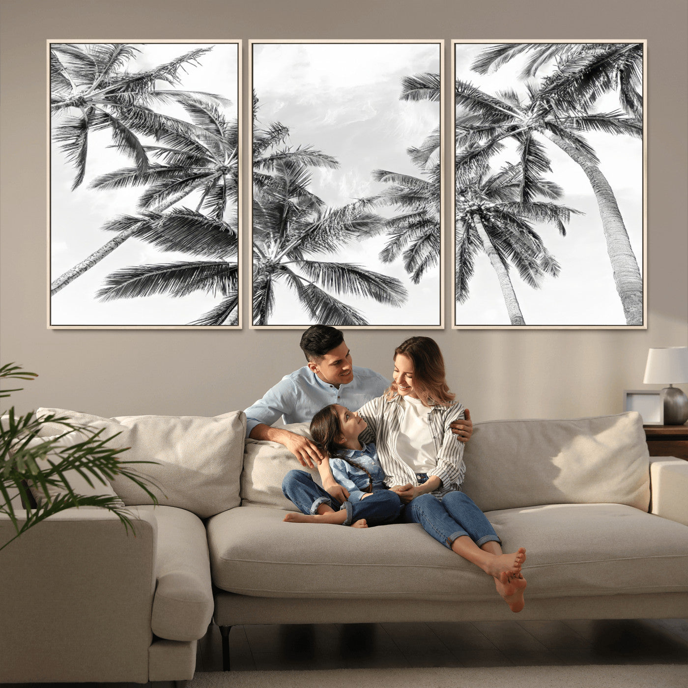 Black and white tropical palm trees viewed from below, swaying gently against a bright sky, creating a serene and elegant coastal atmosphere.