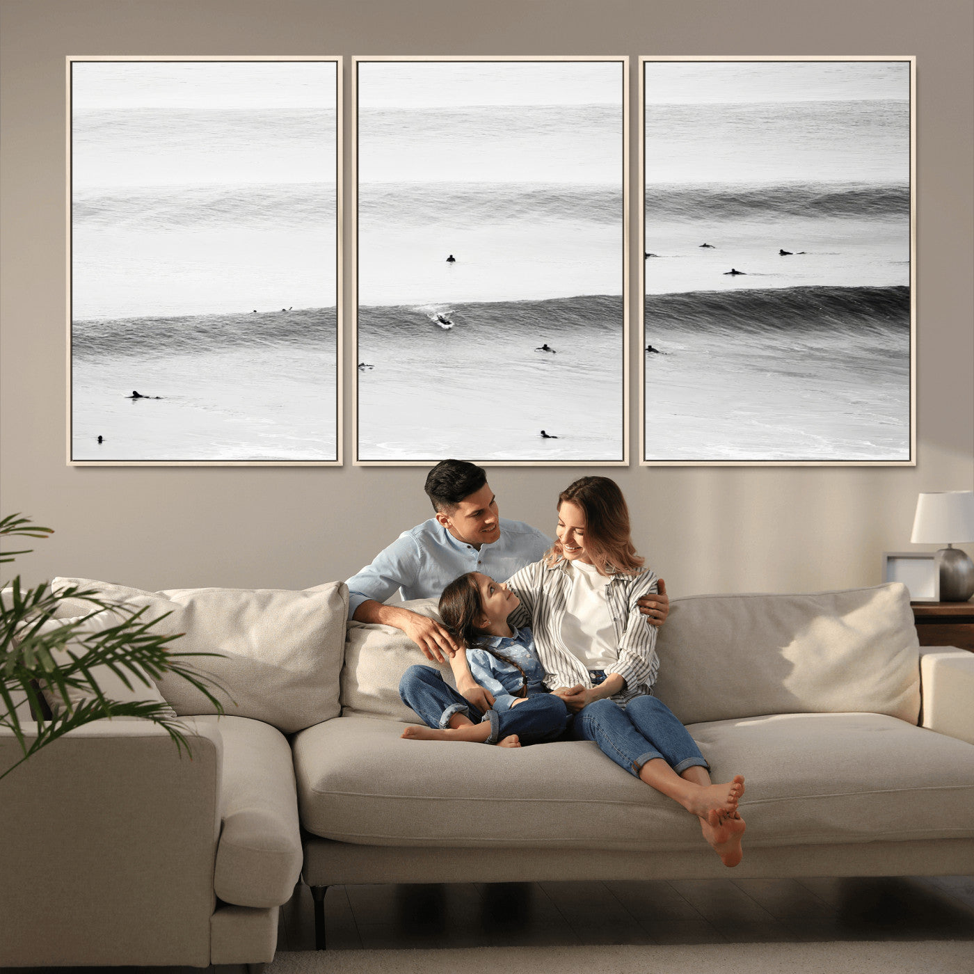 A monochrome photograph of swimmers gliding through gentle ocean waves, evoking a sense of calm and movement.