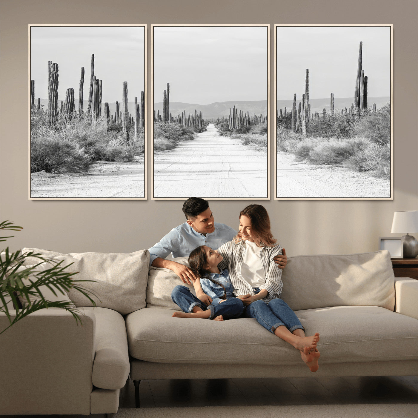 A black and white desert road stretching through a cactus-filled landscape, creating a rugged and timeless southwestern aesthetic with a sense of adventure.
