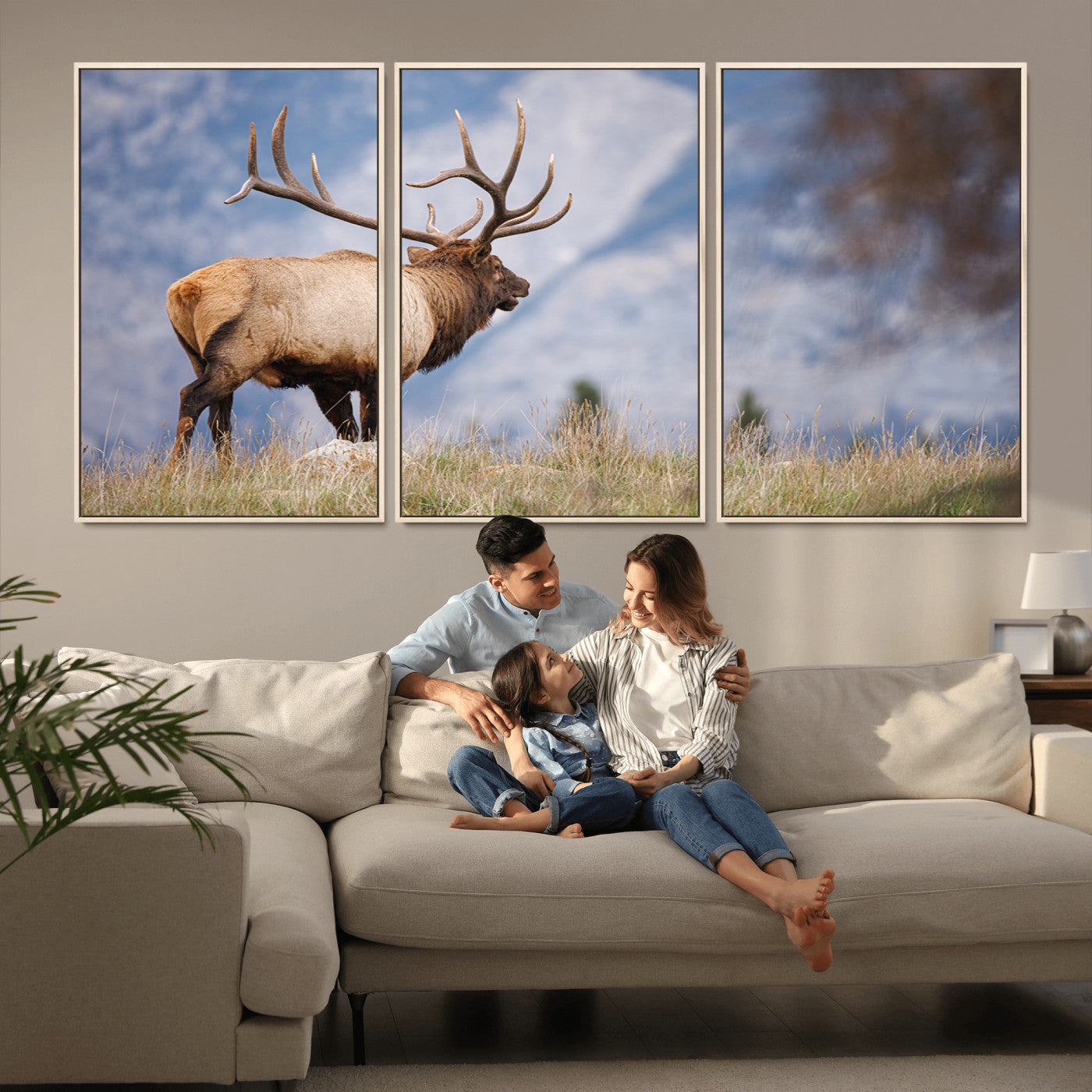 Elk with antlers standing on grass with mountain background, ideal for rustic, cabin, or lodge-inspired wall decor.