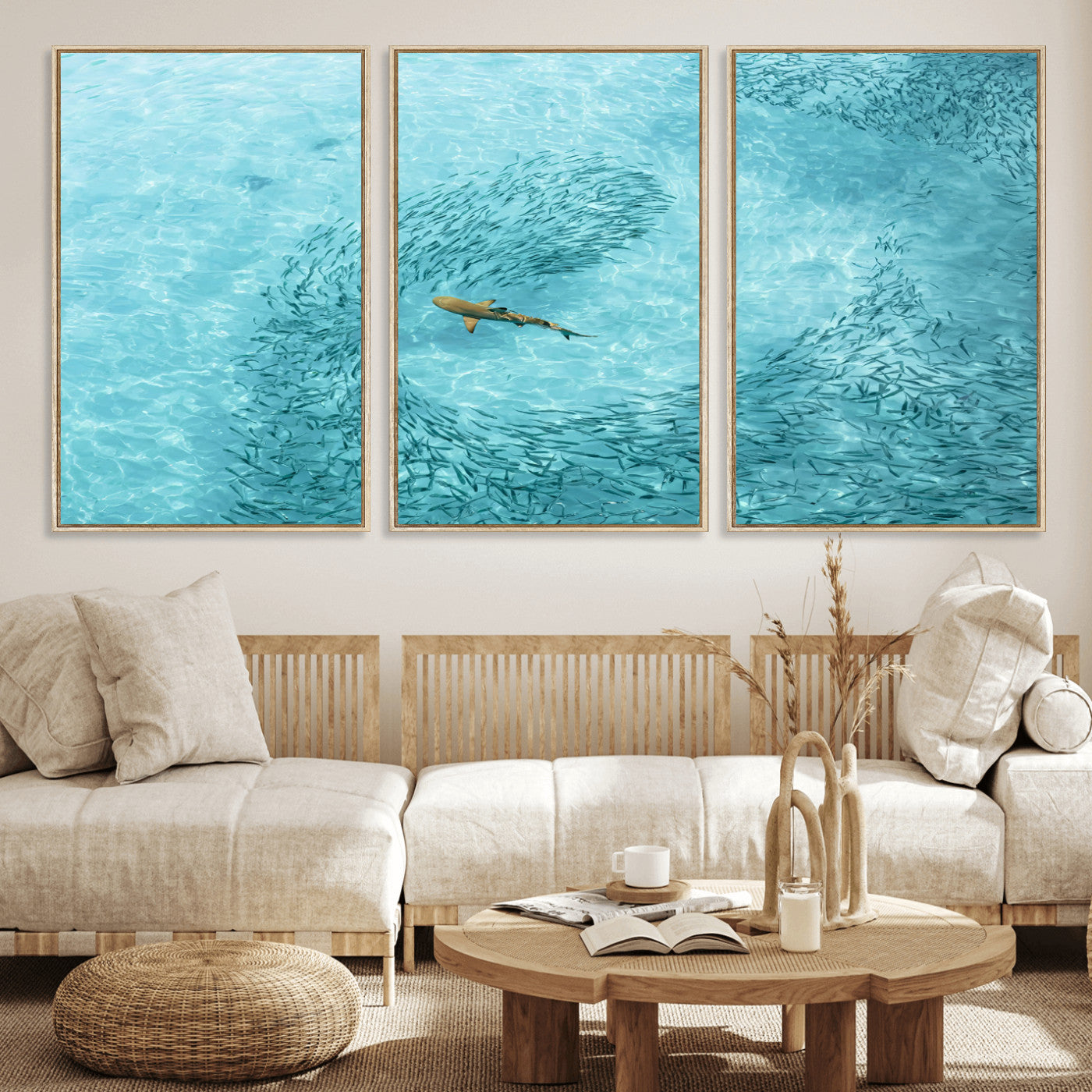Aerial view of a shark swimming through a swirl of fish in clear turquoise waters, perfect for calm coastal or beach house decor.