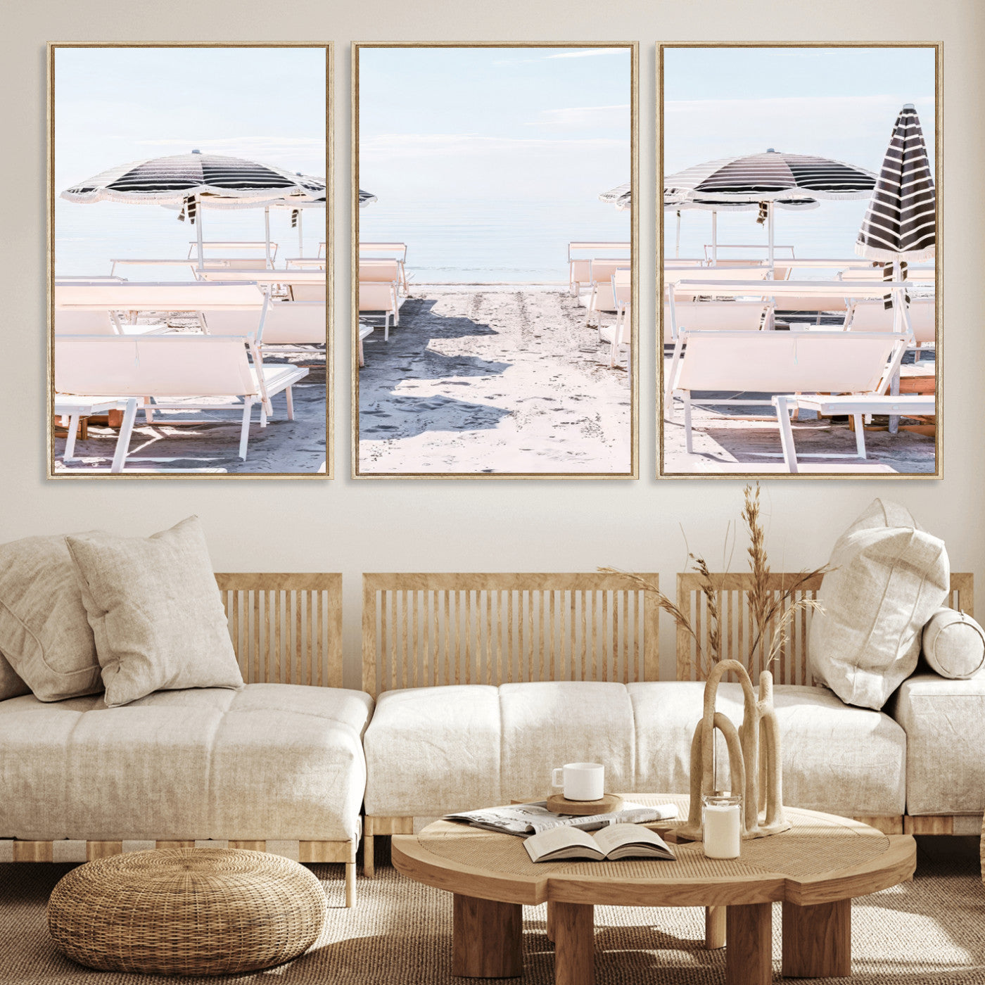 A serene minimalist beach scene featuring striped umbrellas, soft pastel sand, and an elegant lounge setup, creating a tranquil and stylish coastal retreat.