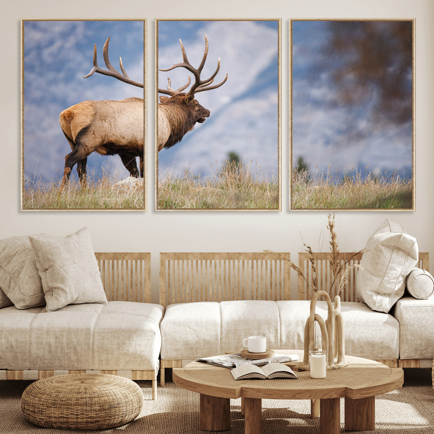 Elk with antlers standing on grass with mountain background, ideal for rustic, cabin, or lodge-inspired wall decor.