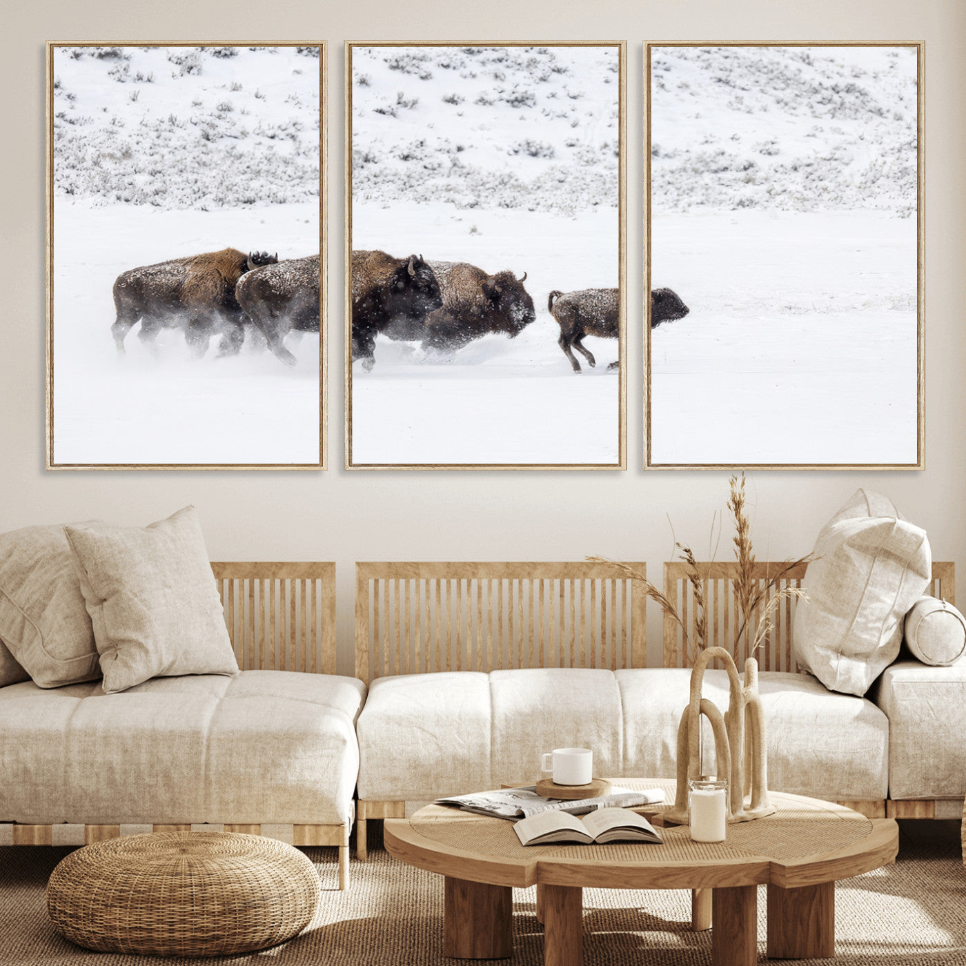 Bison herd running through a snowy open field with mountain backdrop, perfect for rustic or western-themed wall decoration.