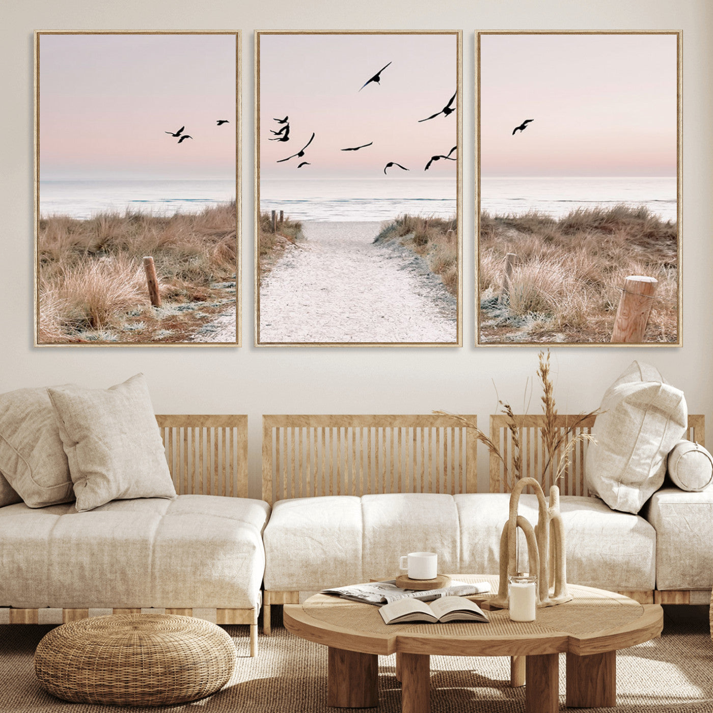 A peaceful coastal pathway leading to the ocean, with birds flying across a soft pastel sky, creating a calm and scenic beach atmosphere.