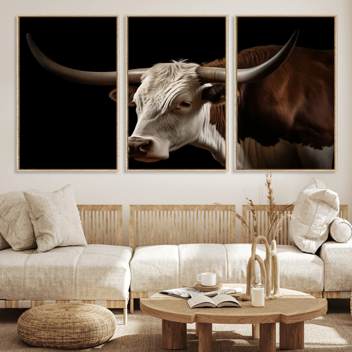 "Close-up of a brown and white longhorn cow with prominent curved horns against a black background."