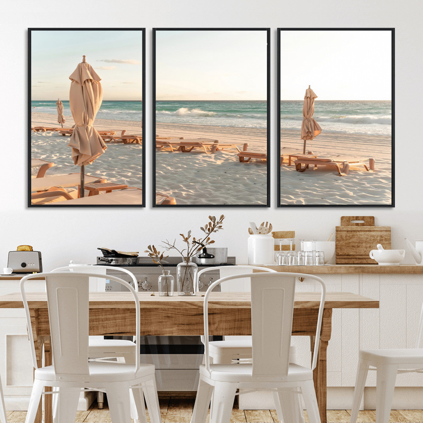 Minimalist photo of empty beach loungers and umbrellas on soft sand, ideal for calm seaside or pastel coastal-style home decor.