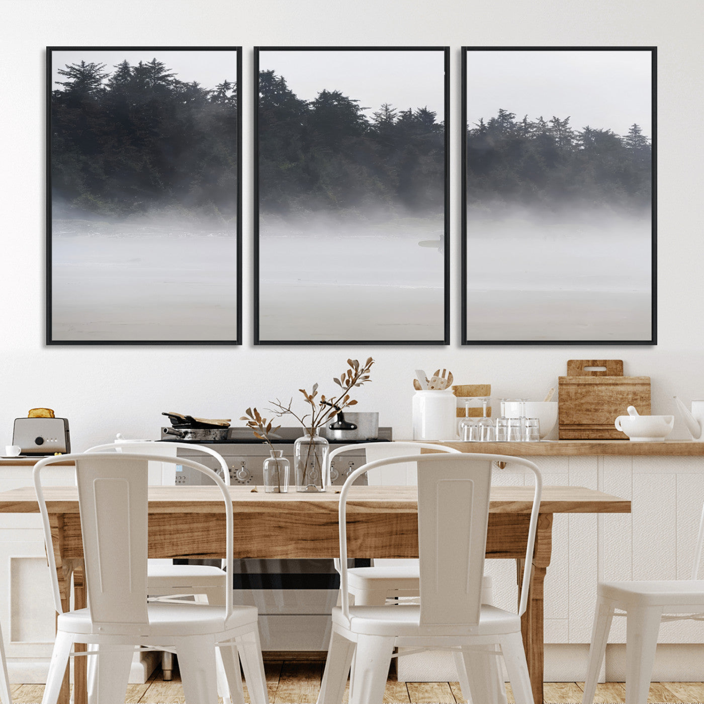 A lone surfer carrying a board through a misty shoreline, surrounded by dense trees and fog, creating a peaceful and mysterious coastal scene.