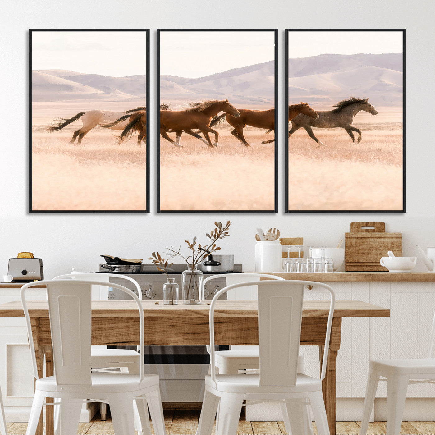 A herd of wild horses galloping through a sunlit desert plain with mountains in the background, perfect for rustic or western-themed wall decor.