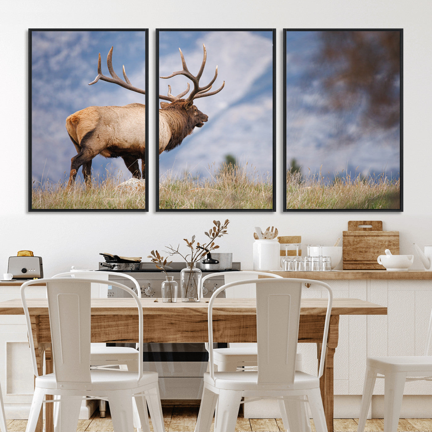 Elk with antlers standing on grass with mountain background, ideal for rustic, cabin, or lodge-inspired wall decor.