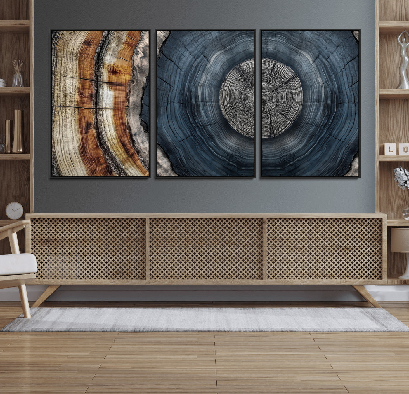 A stunning close-up of a tree trunk showing the intricate, circular growth rings, showcasing the natural textures and rich contrasts in deep blues, browns, and silvers.