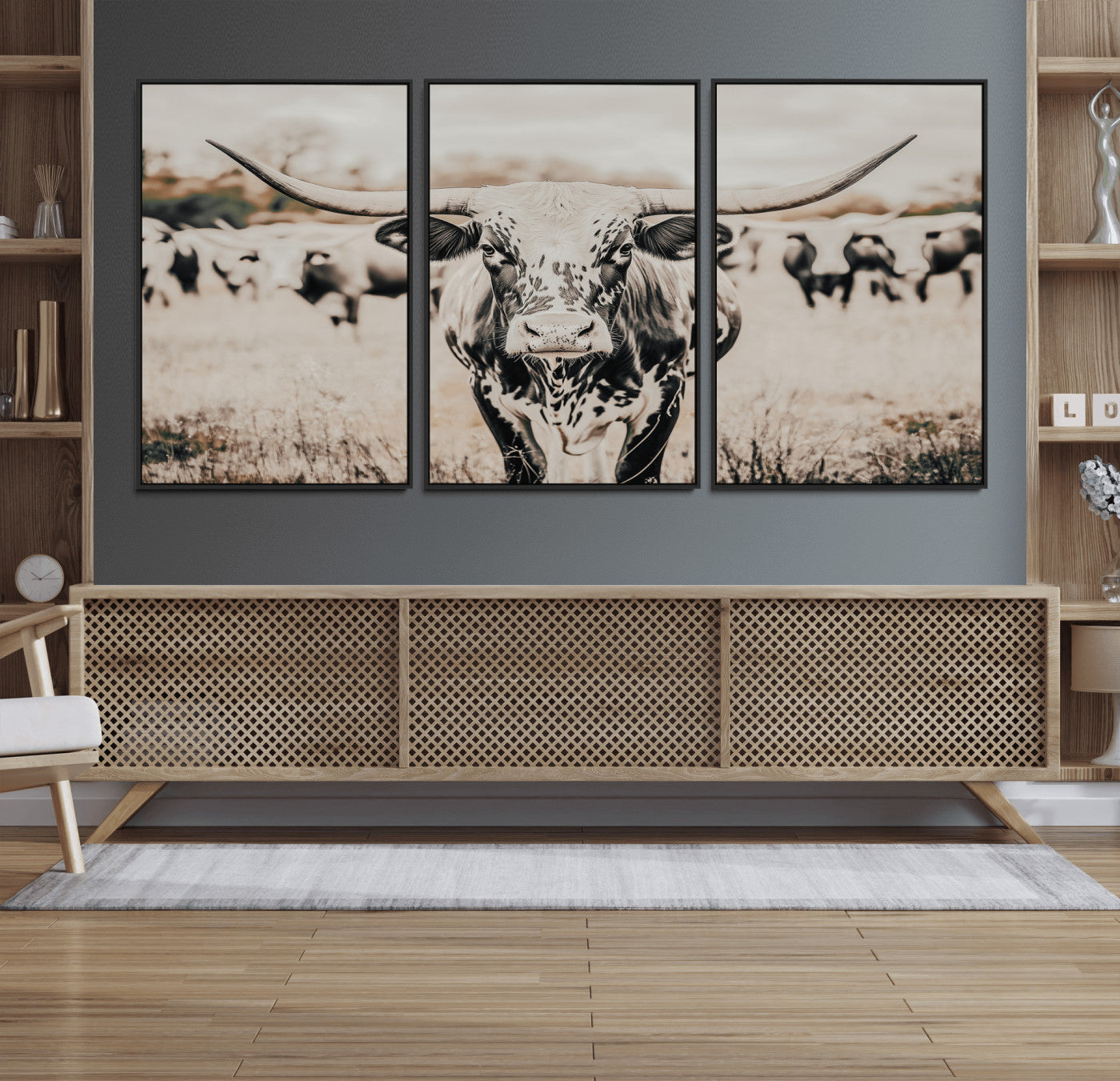 Canvas of a speckled Texas longhorn standing boldly in a field with a herd behind, perfect for rustic western or farmhouse wall decor.