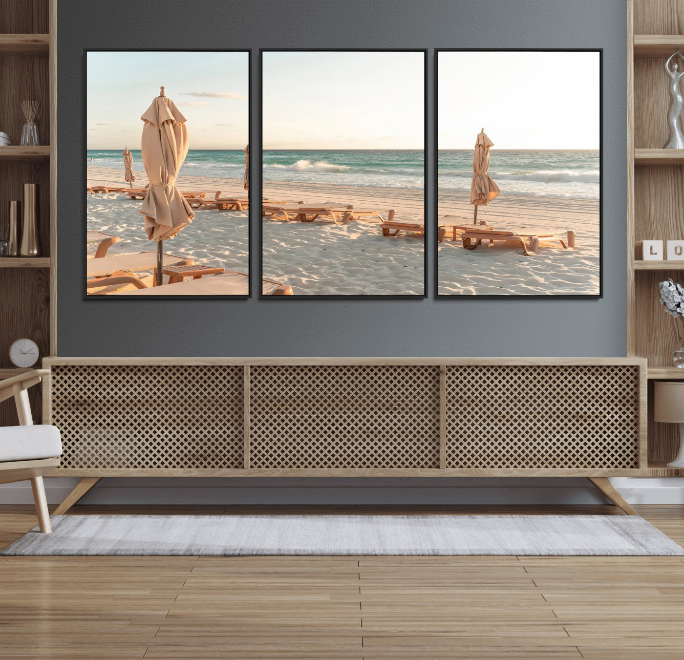 Minimalist photo of empty beach loungers and umbrellas on soft sand, ideal for calm seaside or pastel coastal-style home decor.