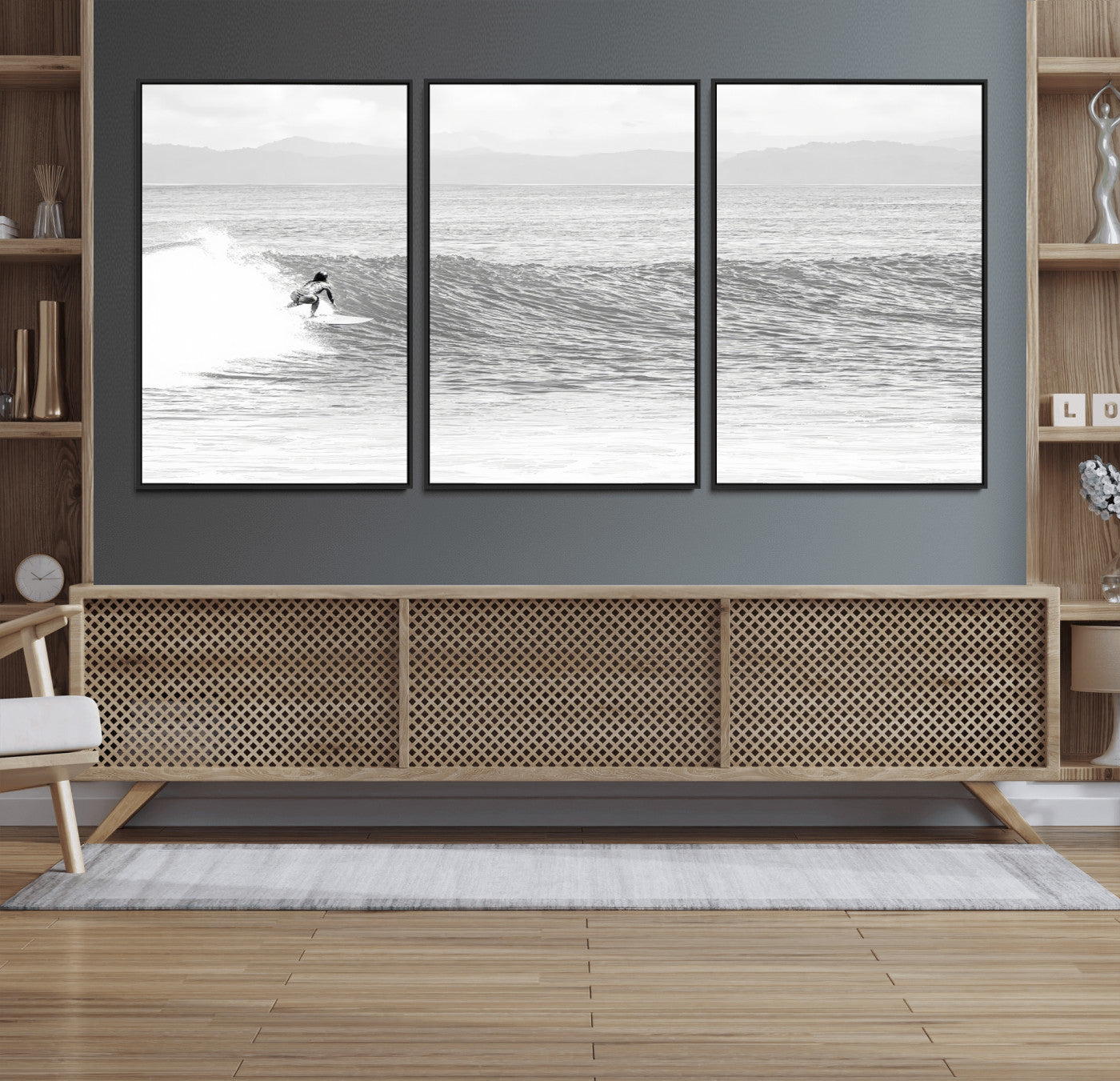 Monochrome photo of a surfer riding a wave with distant mountains, ideal for coastal motion or black and white surf-themed wall decor.