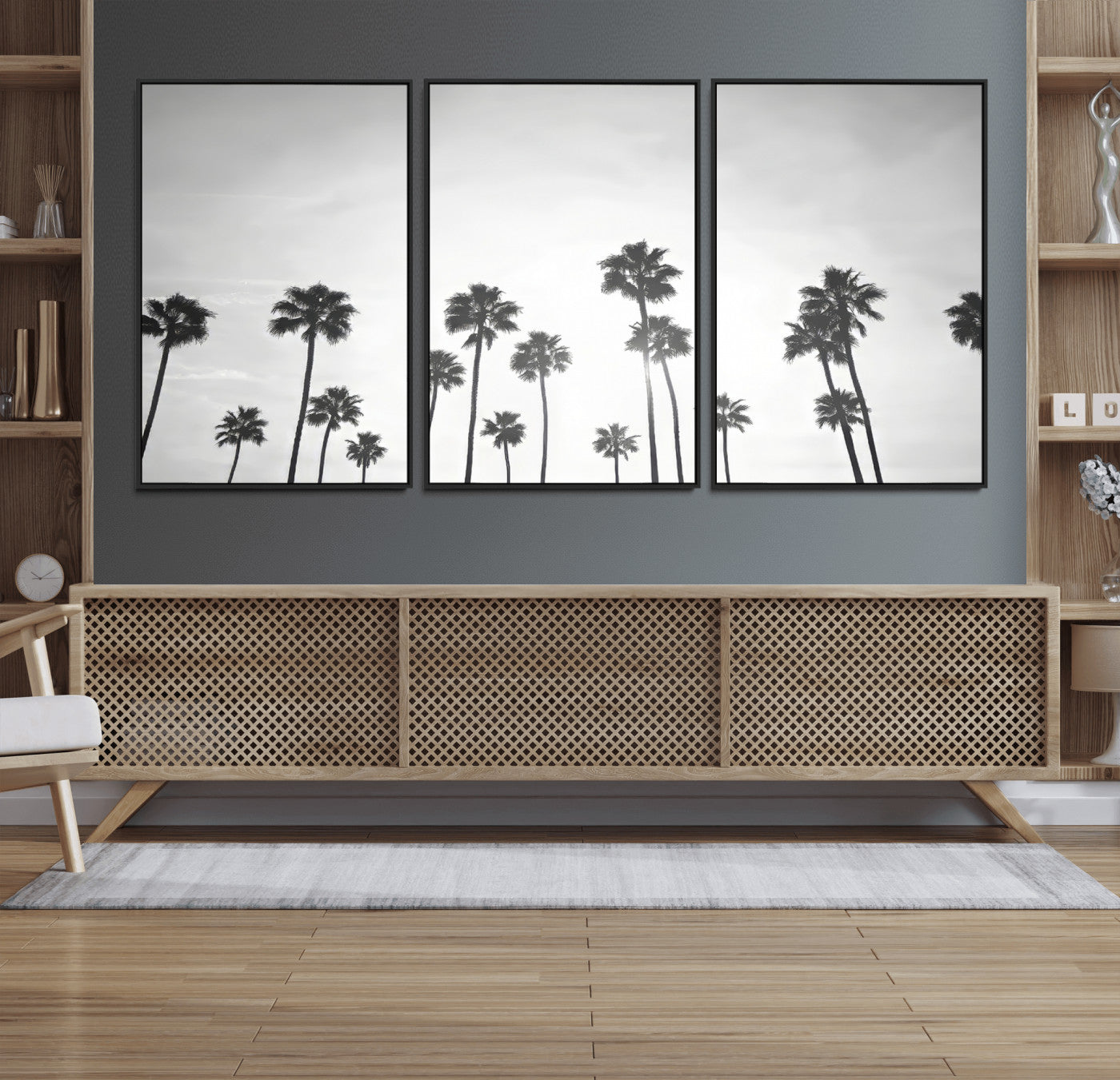 A black and white minimalist scene featuring tall palm trees silhouetted against a bright sky, creating a dreamy and timeless tropical aesthetic.