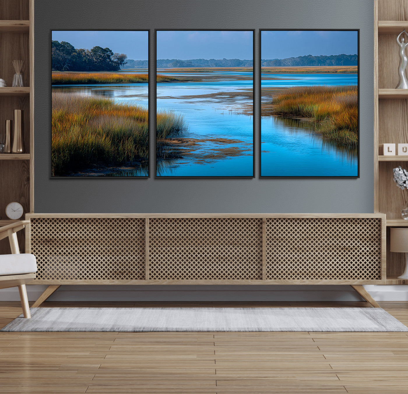 A peaceful marshland scene with calm blue water reflecting the surrounding grasses and trees, capturing the beauty of nature in a serene landscape.