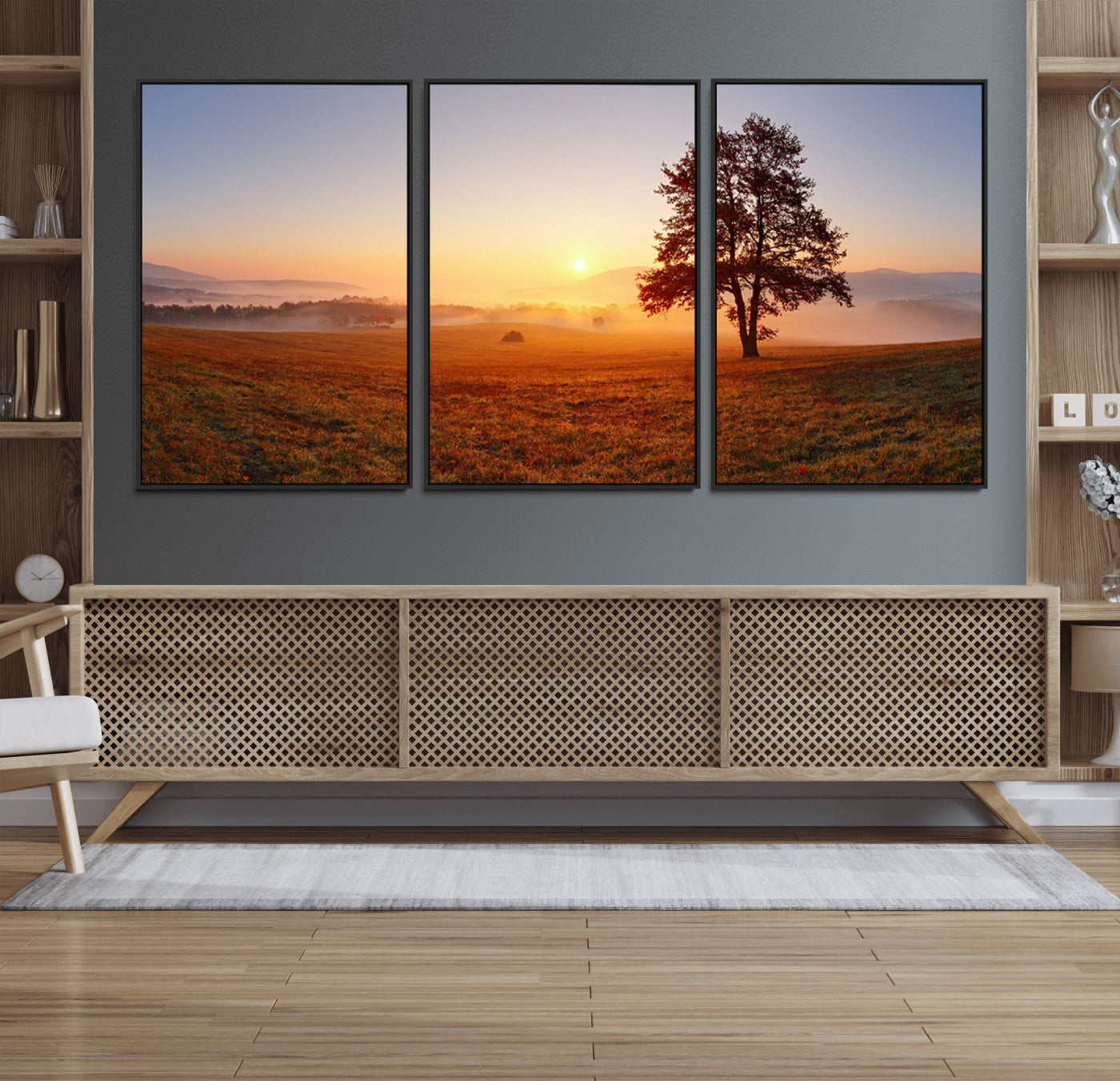 A tranquil landscape at sunrise with a mist-covered field and a lone tree, creating a peaceful and natural atmosphere.