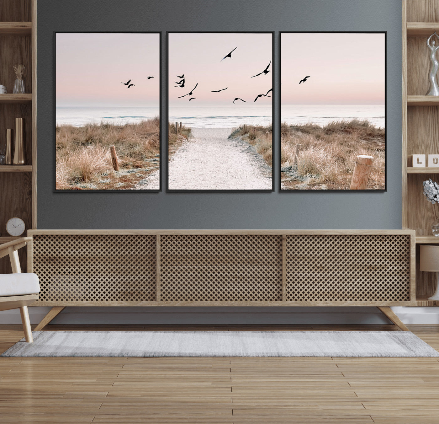 A peaceful coastal pathway leading to the ocean, with birds flying across a soft pastel sky, creating a calm and scenic beach atmosphere.