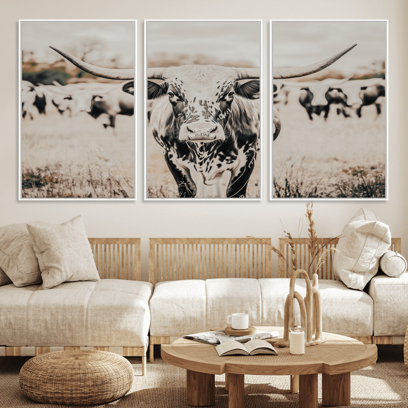 Canvas of a speckled Texas longhorn standing boldly in a field with a herd behind, perfect for rustic western or farmhouse wall decor.