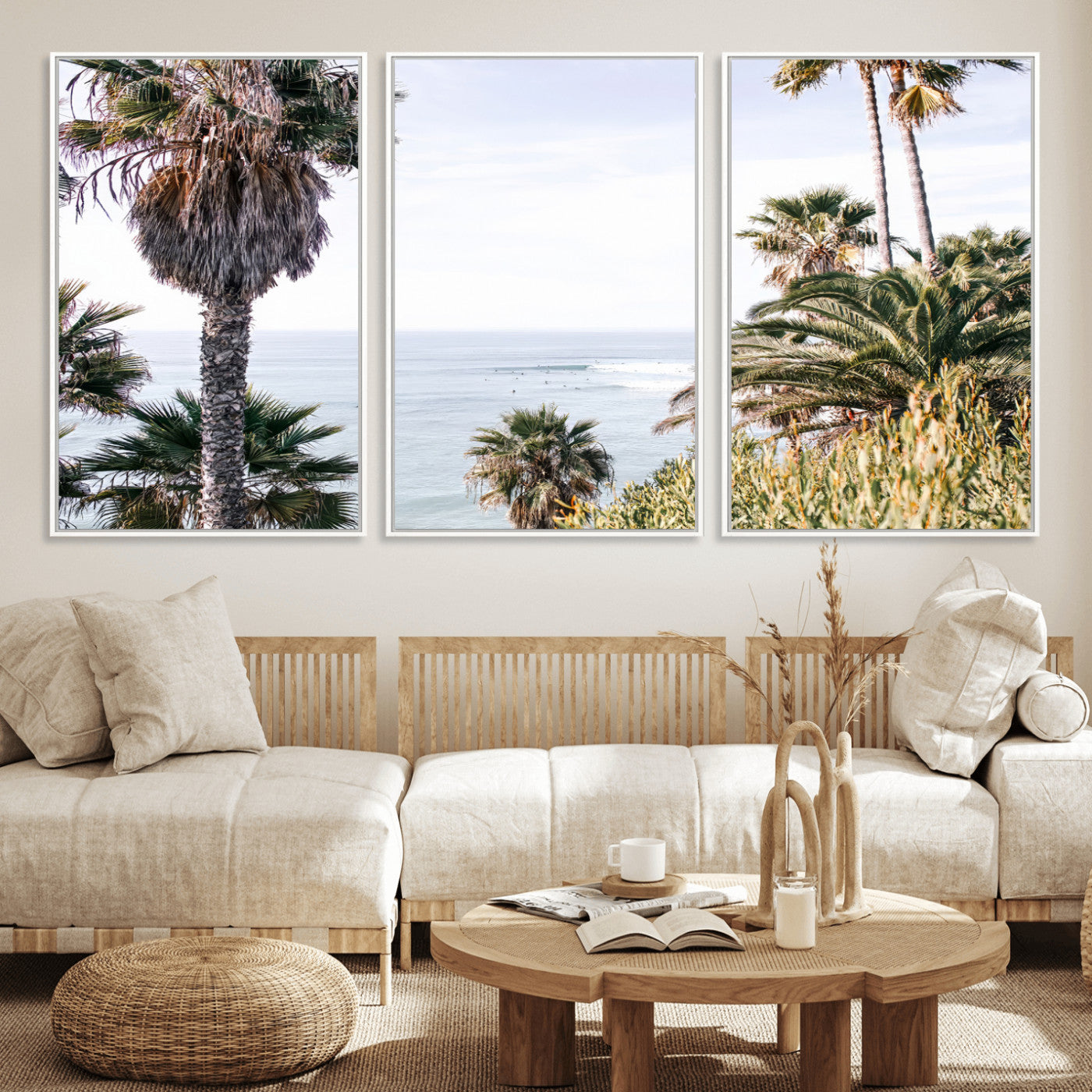 Scenic coastal view with tall palm trees overlooking a calm ocean, soft blue waves, and surfers in the distance, creating a peaceful tropical vibe.
