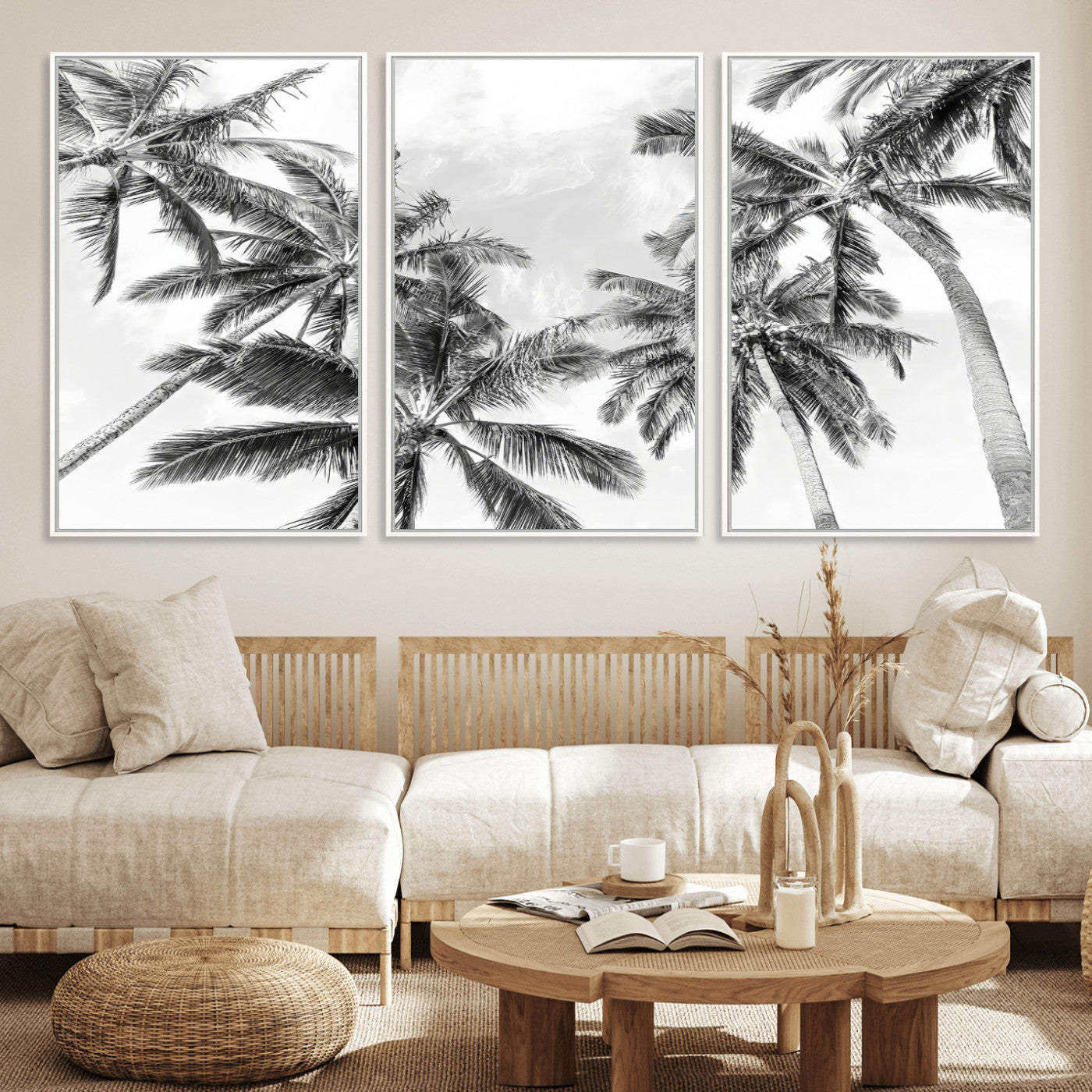 Black and white tropical palm trees viewed from below, swaying gently against a bright sky, creating a serene and elegant coastal atmosphere.
