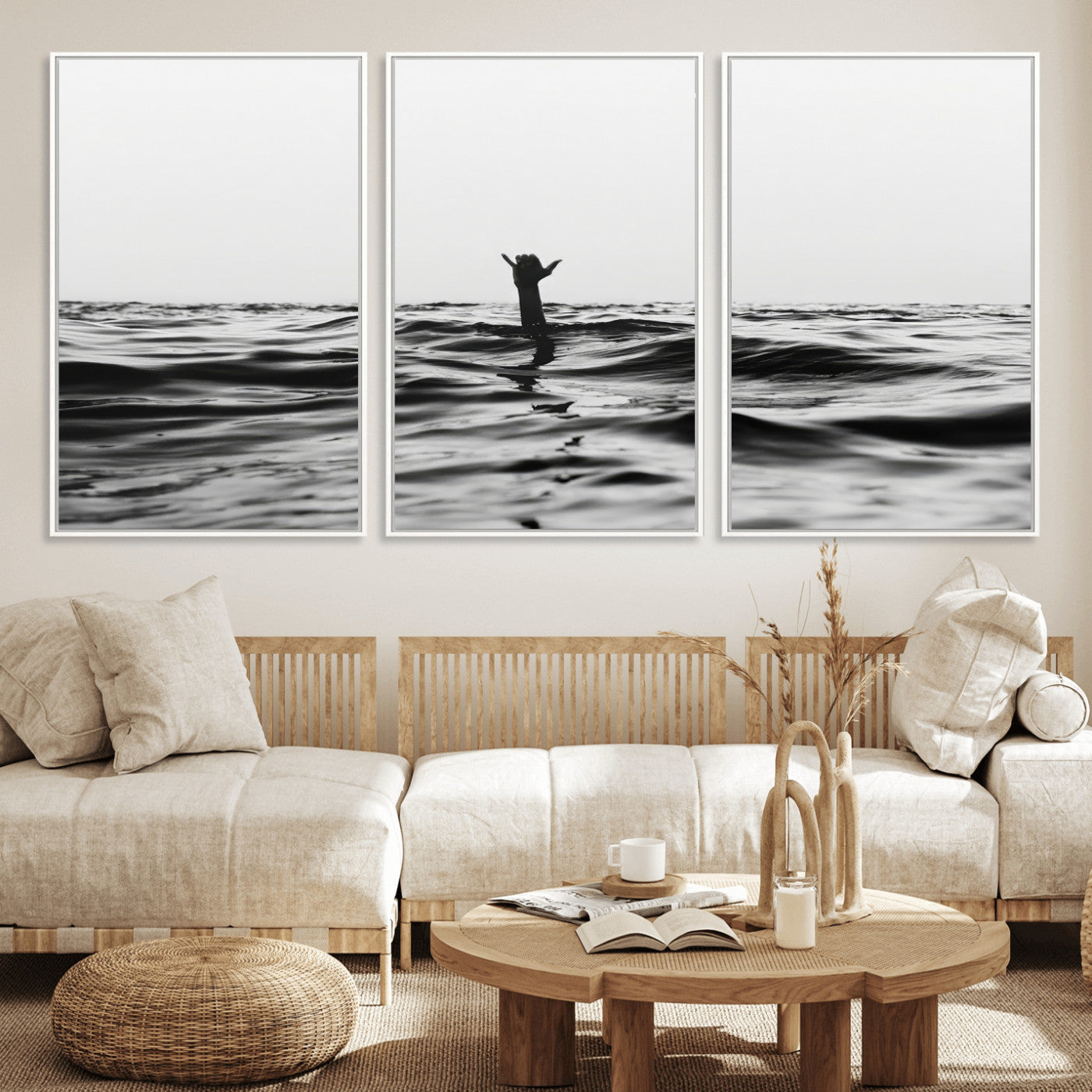 Black and white ocean with a hand making a surfer sign among dark waves, creating a dramatic and minimalist seascape with bold contrast.