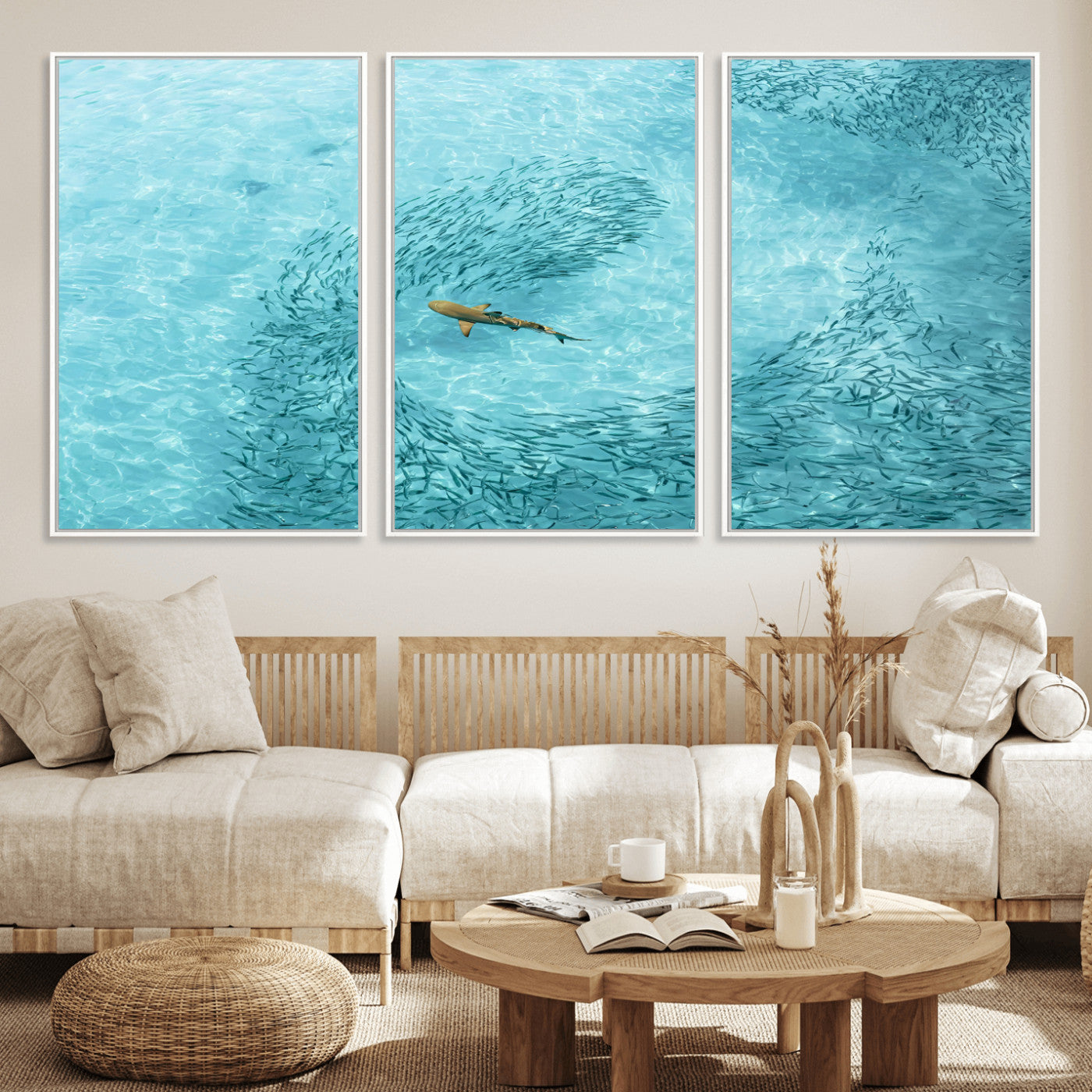 Aerial view of a shark swimming through a swirl of fish in clear turquoise waters, perfect for calm coastal or beach house decor.