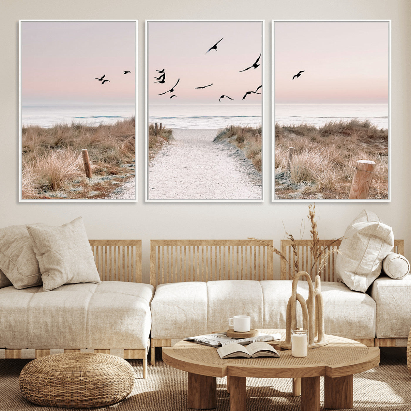 A peaceful coastal pathway leading to the ocean, with birds flying across a soft pastel sky, creating a calm and scenic beach atmosphere.